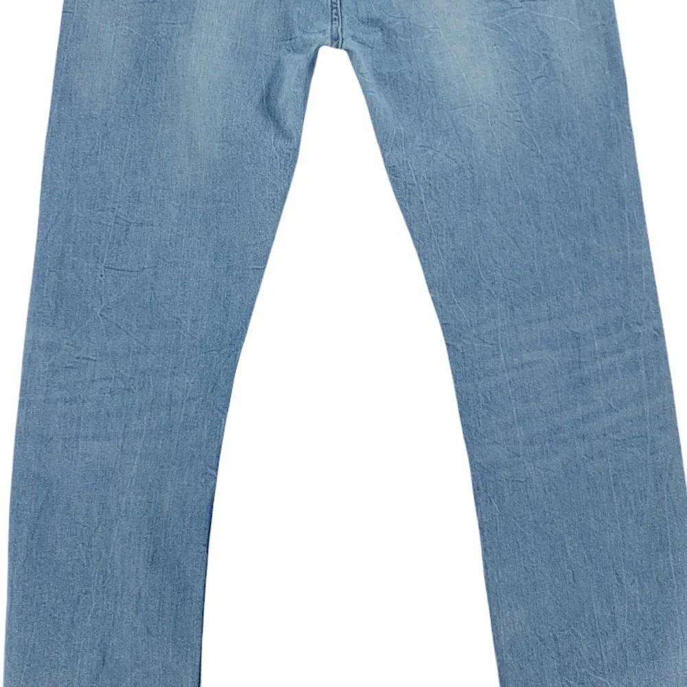 Levi’s 513 Slim Straight Distressed Light Wash Jeans